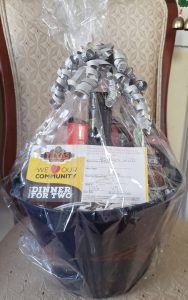 Basket full of goodies from Texas Road House wrapped in cellophane