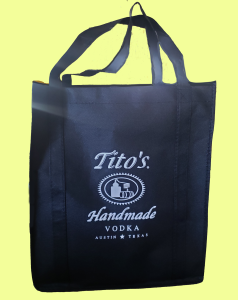 Dark Blue canvas bag with Tito's Handmade Vodka logo in white